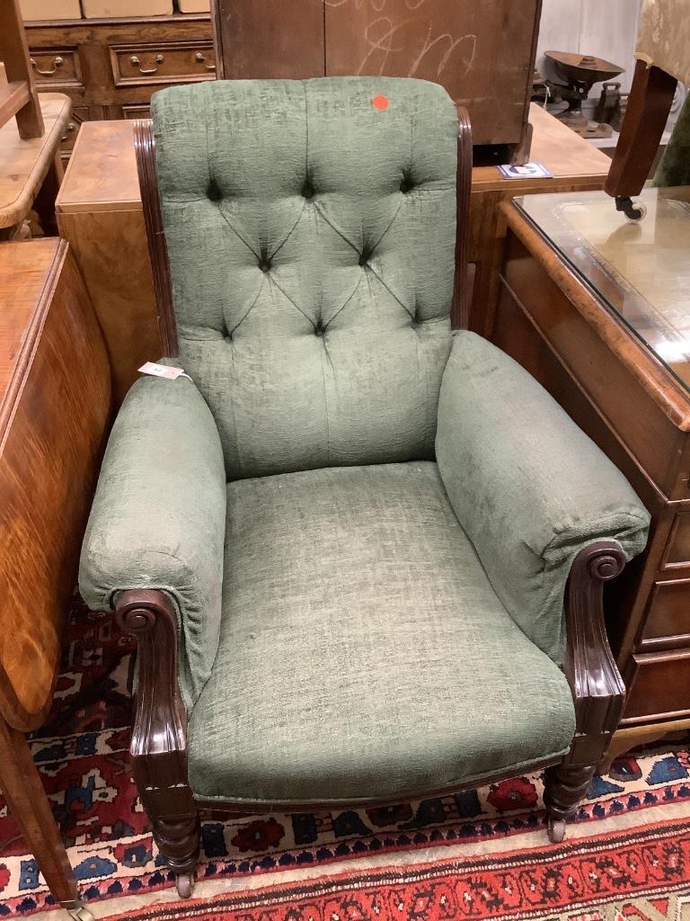 A Victorian mahogany framed armchair, in pale blue upholstery